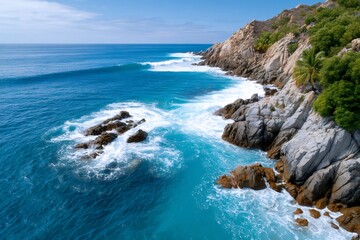 Turquoise waves crashing on the rocky coast of Mexico
