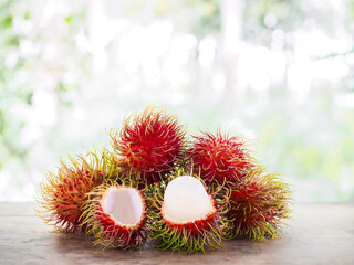 Close-up ripe rambutans on the wooden table.