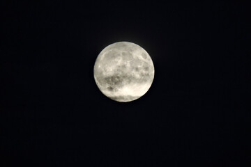 Mysterious full moon in dark clouds