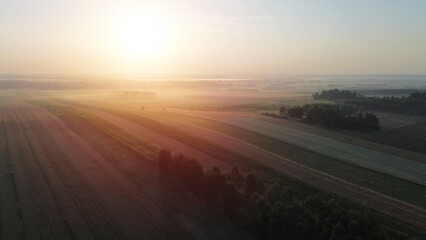 Fototapeta premium Early morning fog enveloping autumn countryside