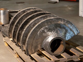 A stack of metal pieces on a wooden pallet