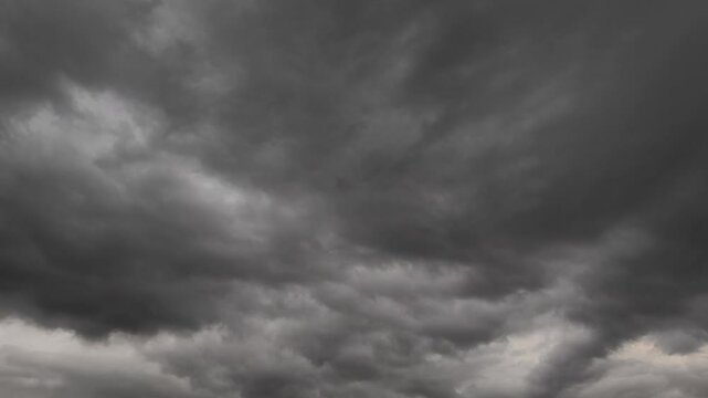 Black stratus cloud at sunset