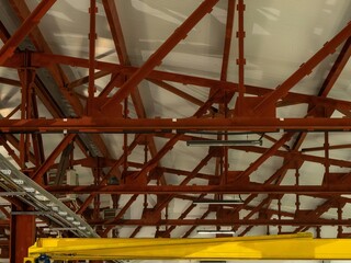 A large, open space with a yellow crane in the foreground