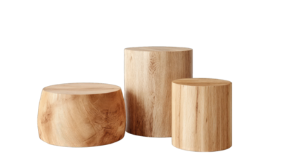 Three wooden cylindrical and rounded pedestals, light beige color, natural wood grain