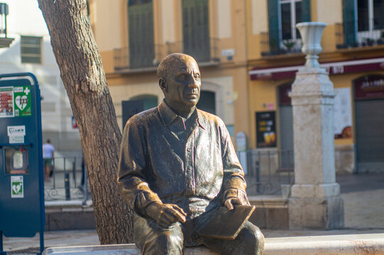 Sculpture of Picasso in front of Casa Natal de Picasso in Malaga, Spain