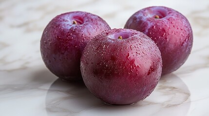 Still Life Photography of Fresh Plums with Water Droplets on a Marble Surface, Capturing a Sense of Natural Sweetness and Refreshment