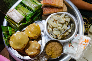 Burmese traditional street food, snacks and sweets at a fresh market and street vendors