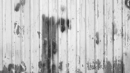 Old Rusty Metal Wall With Peeling Paint And Dark Stains Closeup Front View Black And White Vertical Textured Surface