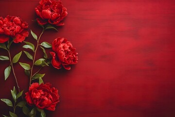Red peonies on dark red wooden background