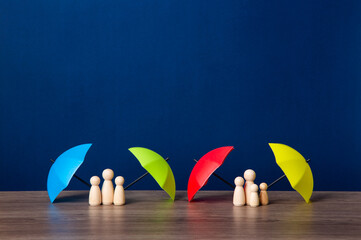 Umbrella and wooden doll figures.
