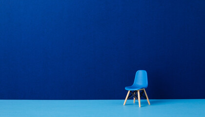 Blue chair against a blue wall. Business Concept