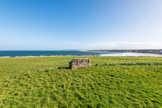 Stone bench overlooking the beach in Thurso, Caithness, Scotland, United Kingdom. Thurso Bay, also known as Scrabster Bay, is a bay of Atlantic water.