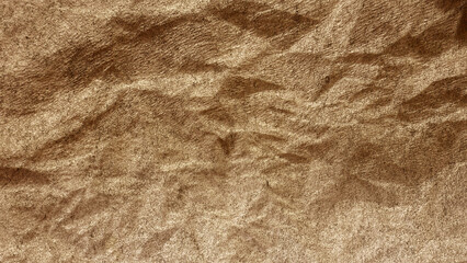 Close-up of wrinkled brown fabric with detailed texture and natural folds