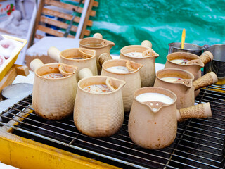 Snow covered persimmons and hot tea, food and snacks vendors at China Snow Town 
