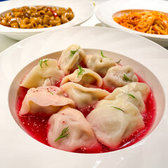 Russian dishes in Harbin, China - beetroot ravioli soup and pasta 