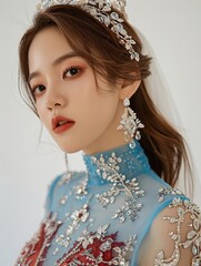 Portrait of a Young Woman in an Elegant Blue Dress and Crown