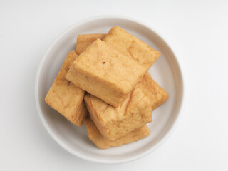 Tofu on a plate, on white background