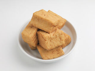 Tofu on a plate, on white background