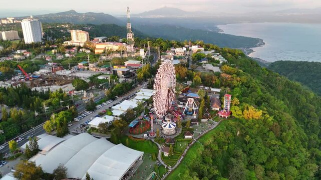 Aerial view of the landscapes surrounding Taal Volcano and Binintiang Malaki mountain in Tagaytay, Philippines - featuring mountains, lake, and scenic natural beauty in 4K resolution