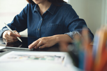 Architecture and interior design concept. Asian business woman architect using digital tablet for...