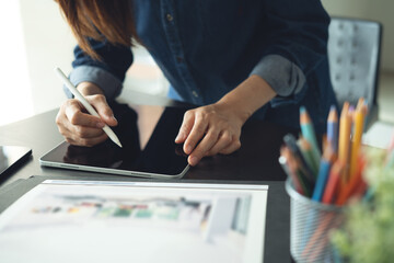 Architecture and interior design concept. Asian business woman architect using digital tablet for...