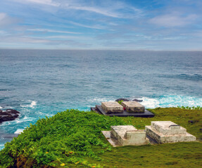 Traditional tombs on the edge of a cliff facing the ocean, Pago Pago, American Samoa, South Pacific