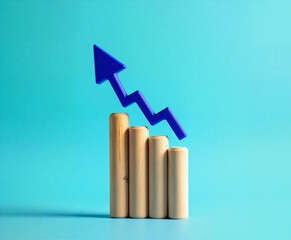 Growing business chart with upward arrow on turquoise background