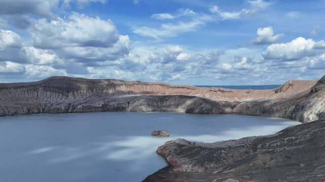 Aerial view of the landscapes surrounding Taal Volcano and Binintiang Malaki mountain in Tagaytay, Philippines - featuring mountains, lake, and scenic natural beauty in 4K resolution