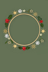 Christmas wooden wreath, star snowflake bauble decorations, winter flora, holly, mistletoe on green. Festive minimal abstract design for Xmas holiday season.