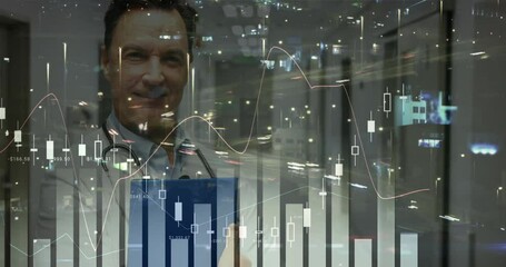 Camera pushing in showing doctor holding tablet animating candlestick charts displaying market data - Powered by Adobe