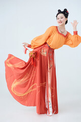 Beautiful dancers wearing ancient Tang Dynasty costumes and makeup performing classical dance