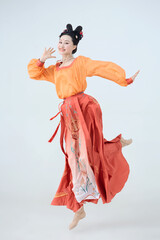 Beautiful dancers wearing ancient Tang Dynasty costumes and makeup performing classical dance
