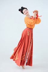Beautiful dancers wearing ancient Tang Dynasty costumes and makeup performing classical dance