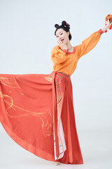 Beautiful dancers wearing ancient Tang Dynasty costumes and makeup performing classical dance