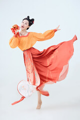 Beautiful dancers wearing ancient Tang Dynasty costumes and makeup performing classical dance