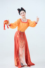 Beautiful dancers wearing ancient Tang Dynasty costumes and makeup performing classical dance