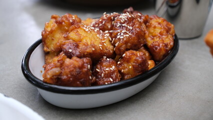 Fried cauliflower with sweet gochujang sauce