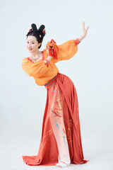 Beautiful dancers wearing ancient Tang Dynasty costumes and makeup performing classical dance