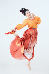 Beautiful dancers wearing ancient Tang Dynasty costumes and makeup performing classical dance