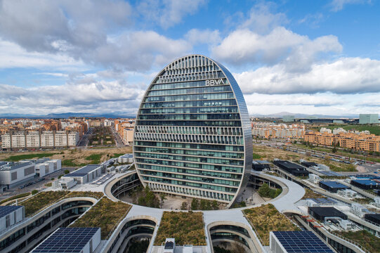Bbva headquarters building dominating madrid skyline on a sunny day
