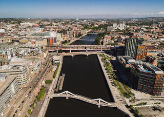 Glasgow Scotland: 18th May 2025: Bridges over the River Clyde on a sunny day drone footage. Caledonian Railway and Squiggly Bridge
