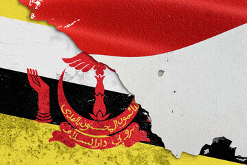 Torn Flags of Indonesia and Brunei Darussalam Depicting Political and Cultural Tension. Split...