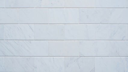 Naklejka premium Elegant White Marble Tile Wall with Subtle Veins Perfect for Modern Interiors and Architectural Designs Showcasing Clean Lines and a Sophisticated Aesthetic