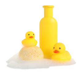 Cute rubber ducks, bottle of bath product, sponge and foam isolated on white