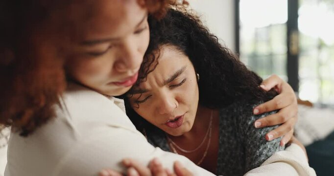 Woman, hug and comfort friend on couch for support, breakup and sympathy for depression. People, emotional and consoling person for relationship fail, cheating mistake and grief of breakdown at house