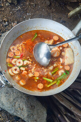 The process of cooking seblak uses traditional methods, namely with a stove and firewood in the rice fields