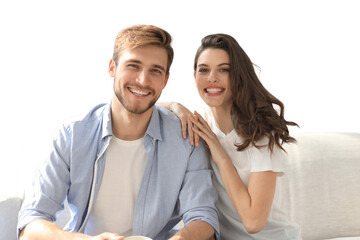 Plakat Portrait of cute young couple sitting in sofa on a transparent background