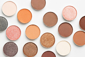 Beautiful eyeshadow refill pans on white background, flat lay