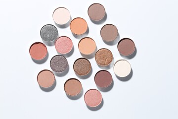 Beautiful eyeshadow refill pans on white background, flat lay