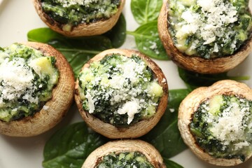 Tasty stuffed mushrooms served on table, top view